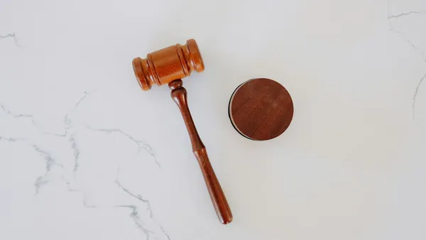Wooden gavel and block on marble.